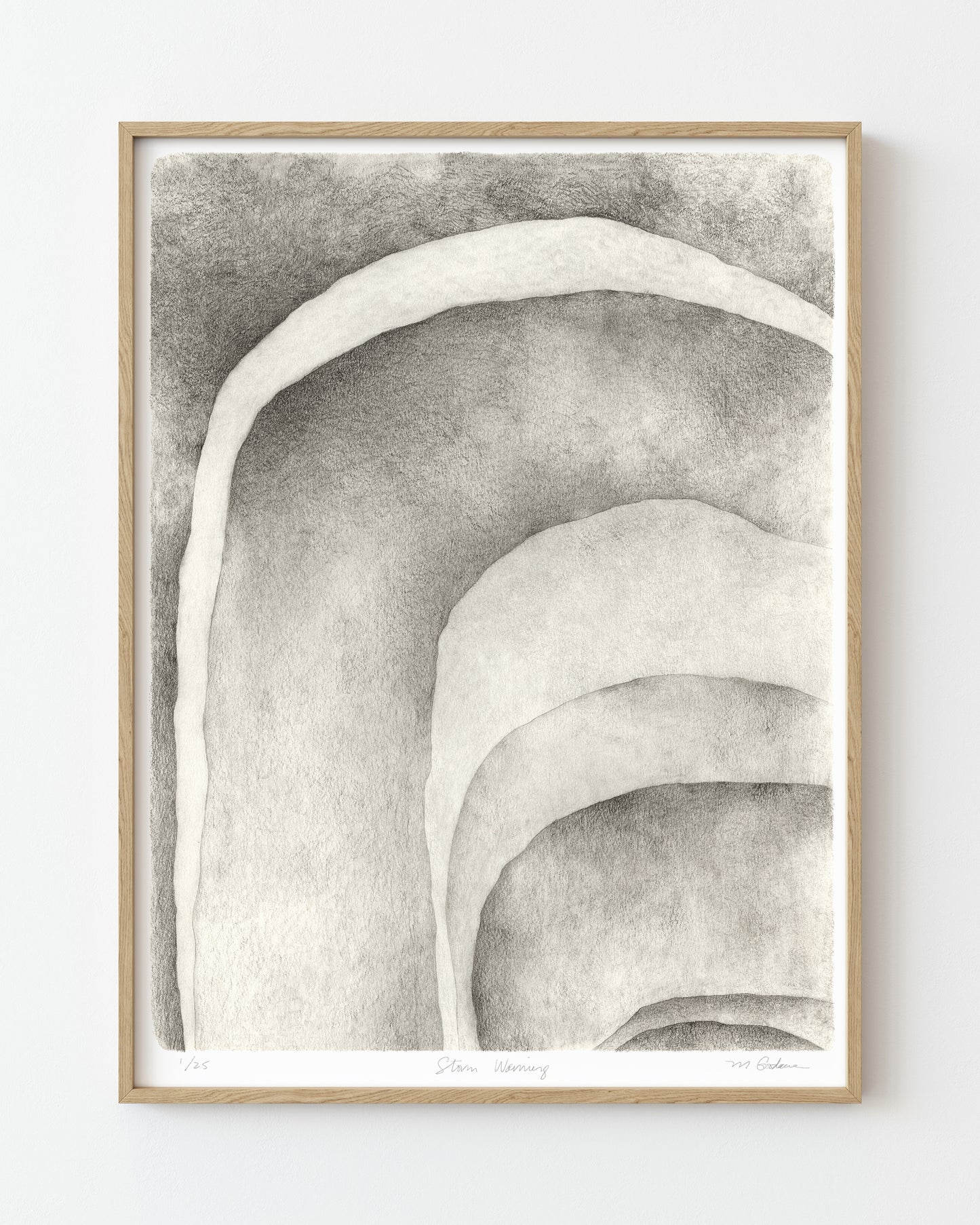 Framed abstract graphite drawing of shaded curved shapes.